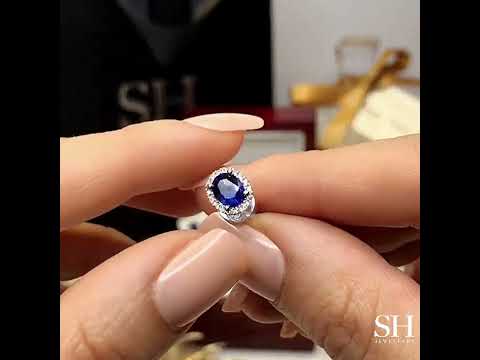 Glamorous oval royal blue sapphire and diamond halo studs - W0311