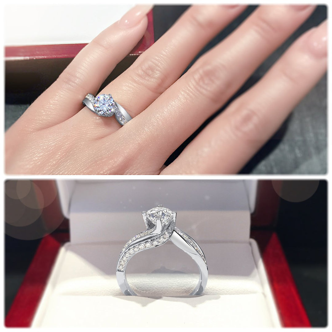 Four claw twist with polished band and sweeping diamonds - W0331